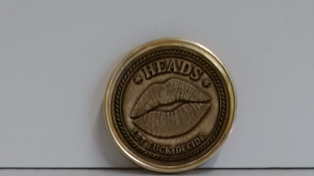 Front of a brass 40mm custom engraved challenge coin