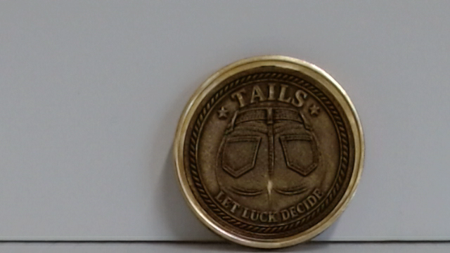 Back of a brass 40mm custom engraved challenge coin